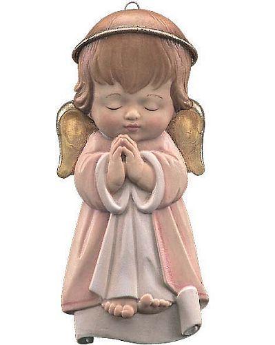 Eine kleine Engel- oder Schutzengel-Figur mit geschlossenen Augen und gefalteten Händen